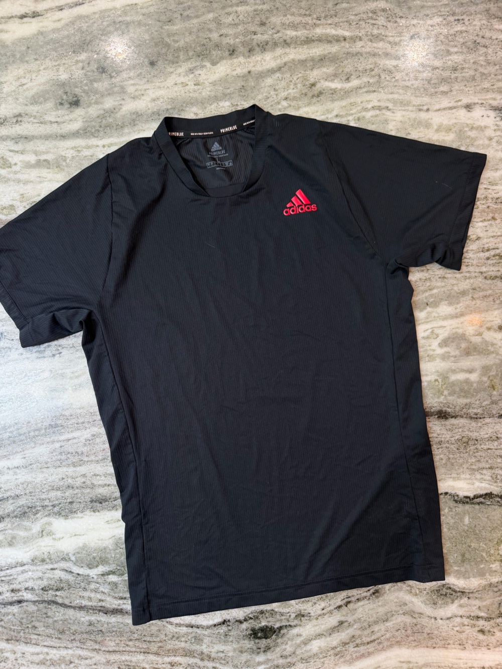 Adidas Black Short-Sleeve Athletic Tee with Red Logo
Men’s Large